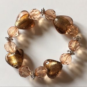 Stretchy, beaded bracelet w/ golden foiled hearts.